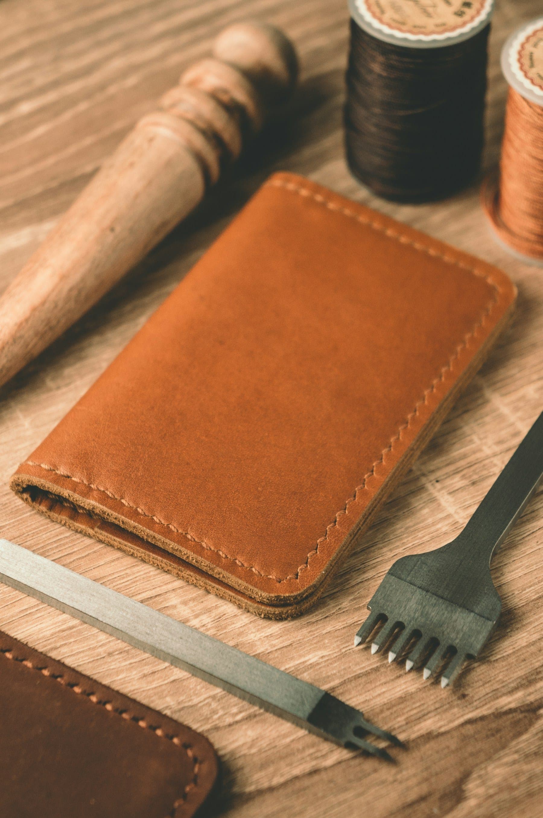Hand-stitched leather goods and atelier tools